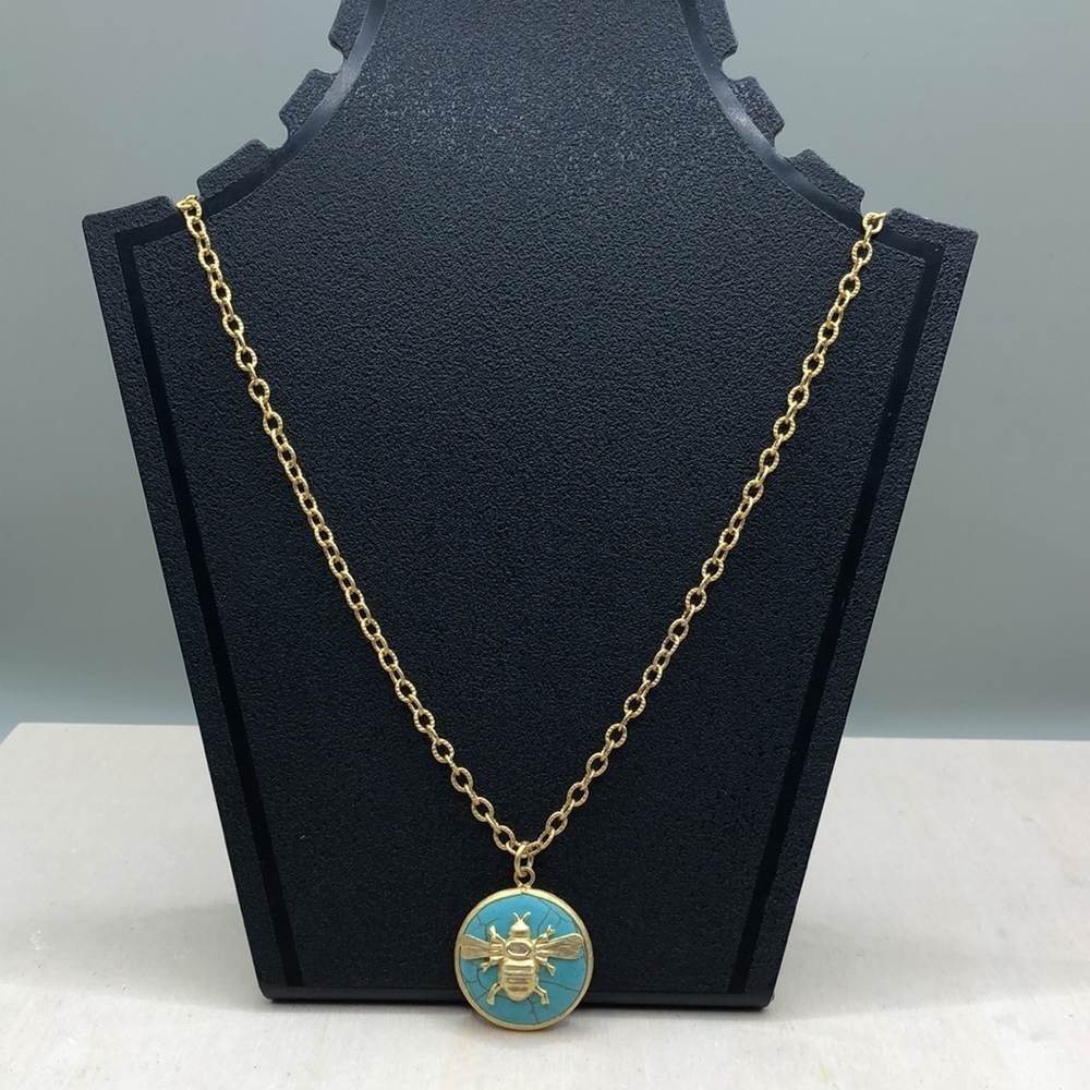 Gold tone chain necklace turquoise honey bee pendant.
